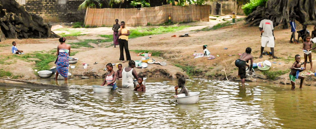 People washing clothes in a river