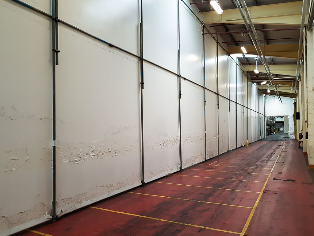 Shrinkwrapped industrial screen in a food and drink factory in Rugby.