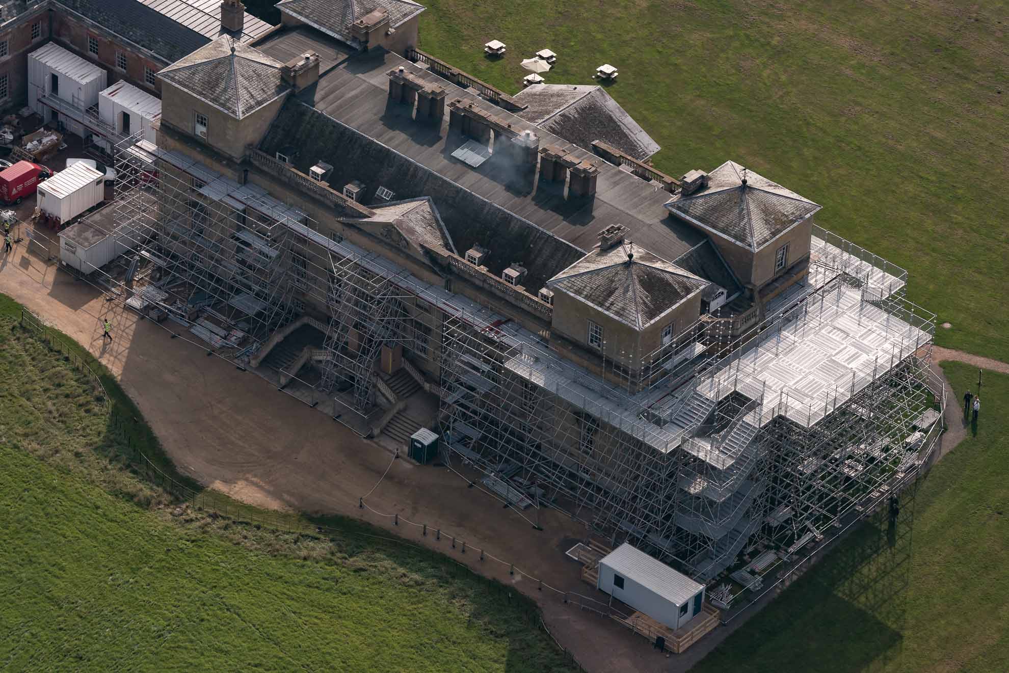 Scaffold on stately home for conservation works erected using Layher with a public access staircase and viewing deck