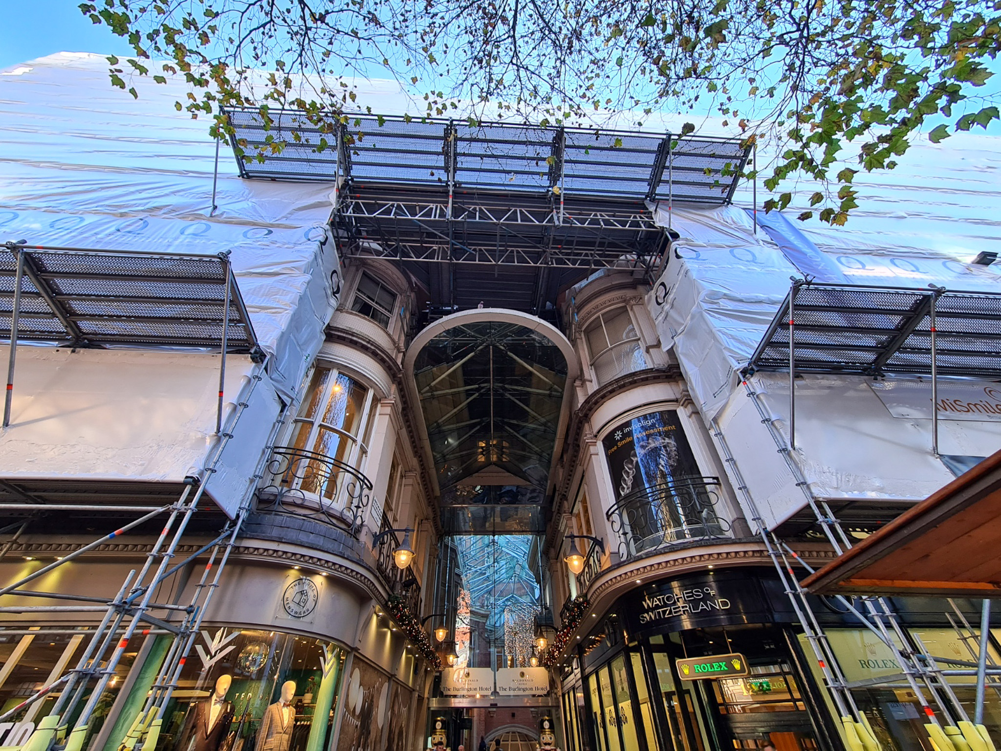 Fully sheeted scaffold with pedestrian protection lift and cantilever fan on the Burlington Hotel in Birmingham.