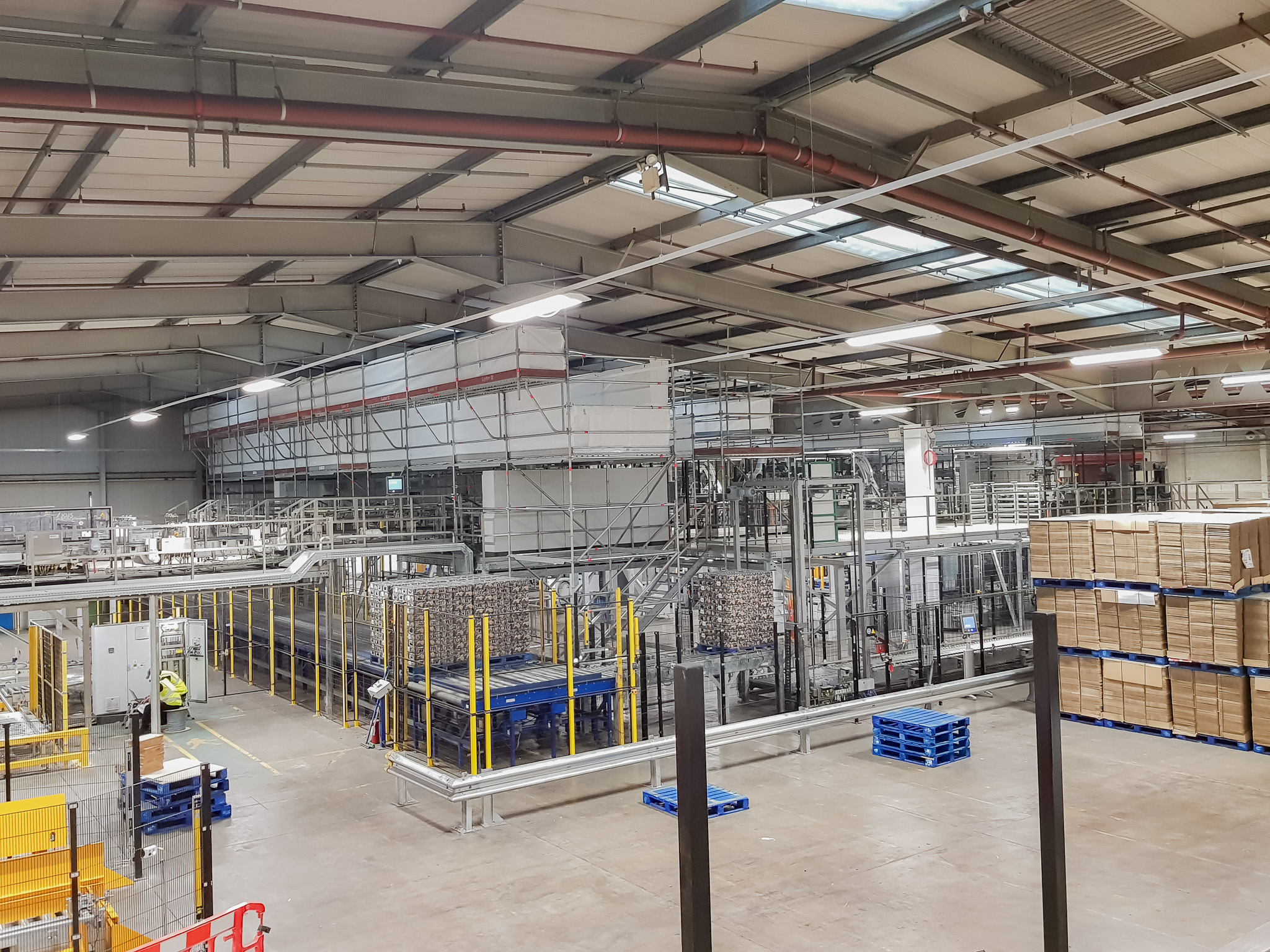 Access scaffold over conveyors in a food and drink factory in Rugby.